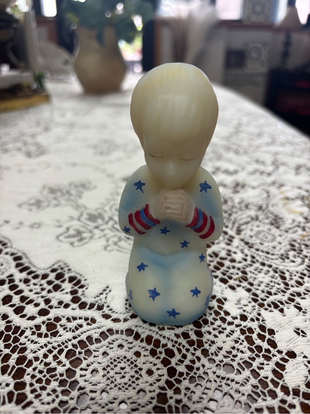 Praying Figurine with Blue Stars and Red Stripes